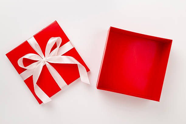 istock Open red gift box on color background, top view 2248925198