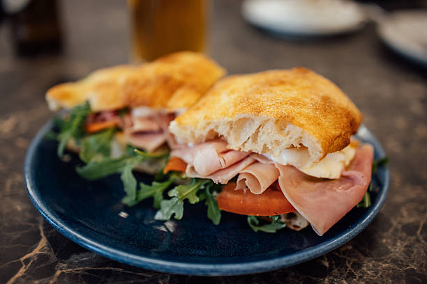 istock Focaccia sandwich with ham, mozarella cheese and fresh salad 2248925705