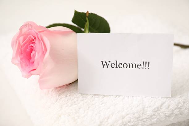 istock Card with word Welcome, rose and towel on white table, closeup 2248926862