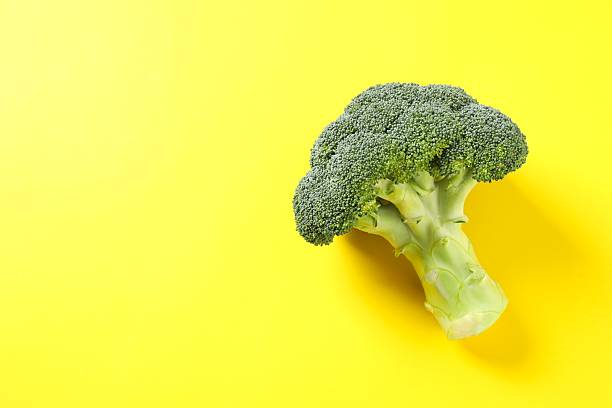 istock Fresh green broccoli on color background, top view, space for text 2248929808