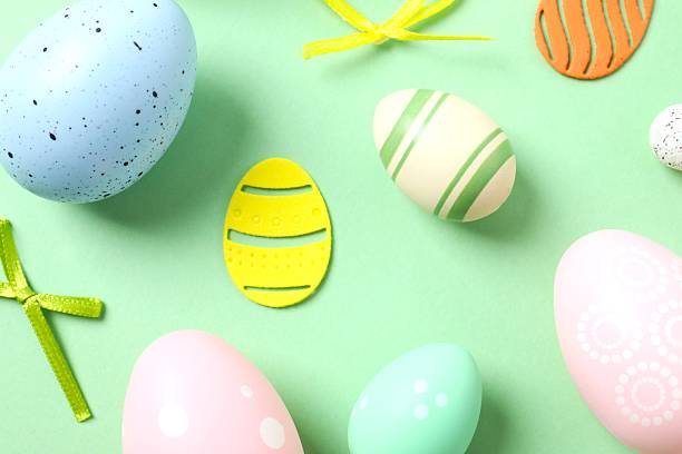 istock Happy Easter. Colorful eggs on green background, space for text or advertising 2248930439