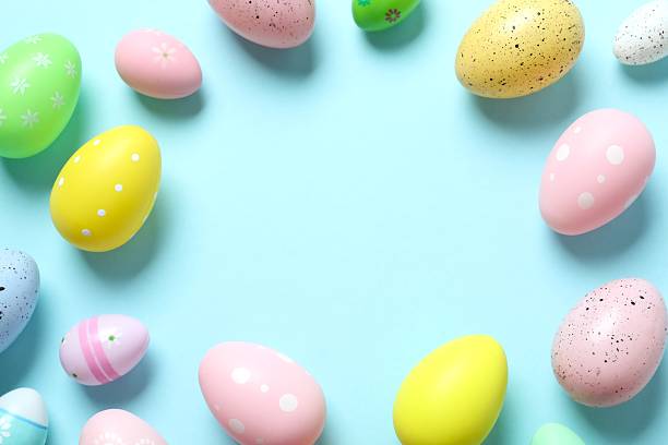 istock Colorful eggs on blue background, space for text or advertising 2248930542