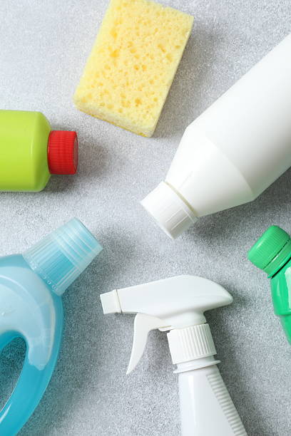istock Many different house cleaning products on color background, top view 2248930921