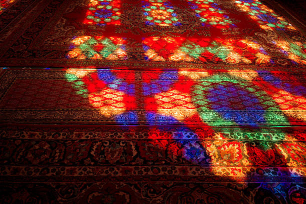 istock Colorful stained glass reflections on carpet 2248931110
