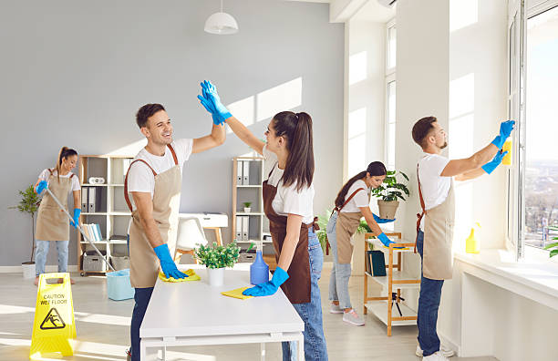 istock Cleaner happy group high five finish working, professional janitor service busy completing cleaning 2248931483