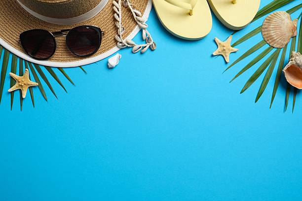 Flat lay with beach accessories on color background. Vacation concept
