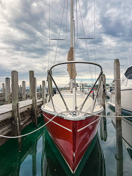 Beautiful Red Sailboat Docked in the Harbor