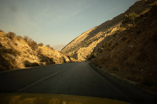 istock Winding mountain road in a dry landscape 2248933977