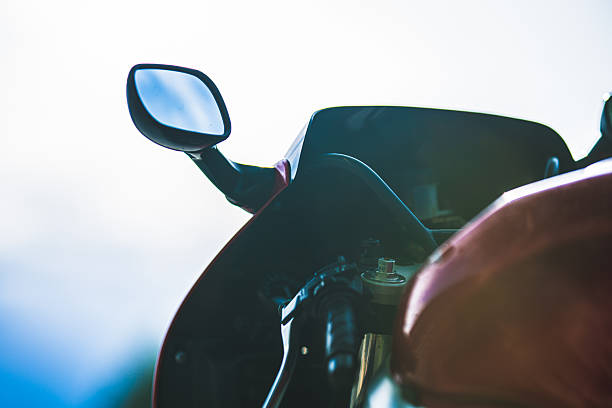 istock Sport motorcycle cockpit and mirror silhouette against bright sky.. 2248935871
