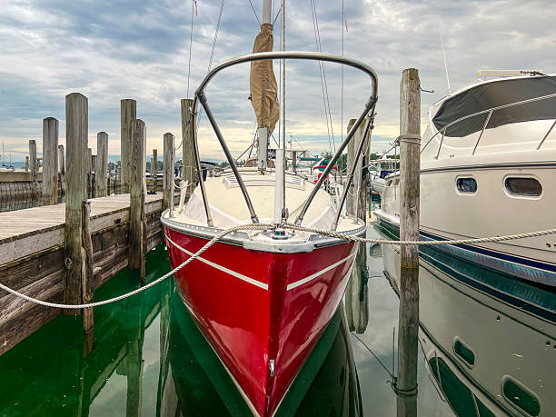 istock Beautiful Red Sailboat Docked in the Harbor 2248936750