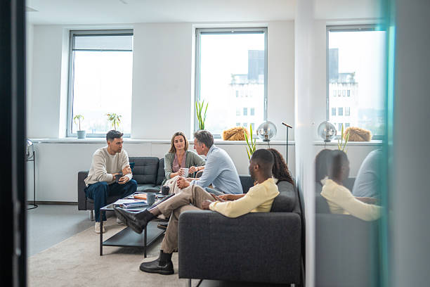 istock Diverse Coworkers Engaging in Warm Office Discussion Together 2248939060