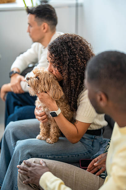 istock Hispanic Woman Embracing Dog in Relaxed Office Environment 2248939111