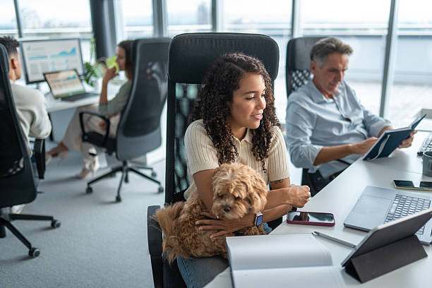 istock Joyful Young Hispanic Woman with Dog in Modern Workspace 2248939204