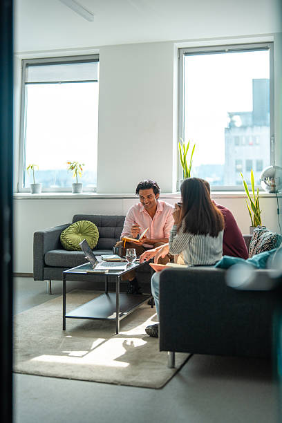 istock Diverse Gen Z Team Engaging in Relaxed Office Discussion 2248940695