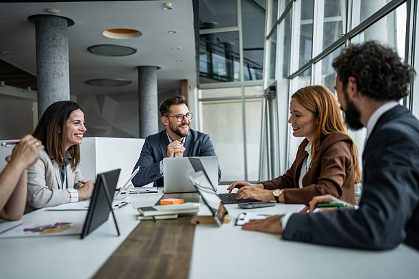 istock Business professionals collaborating and discussing during office meeting 2248944738