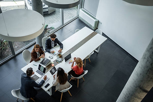 istock Business professionals collaborating in a modern office meeting 2248944749
