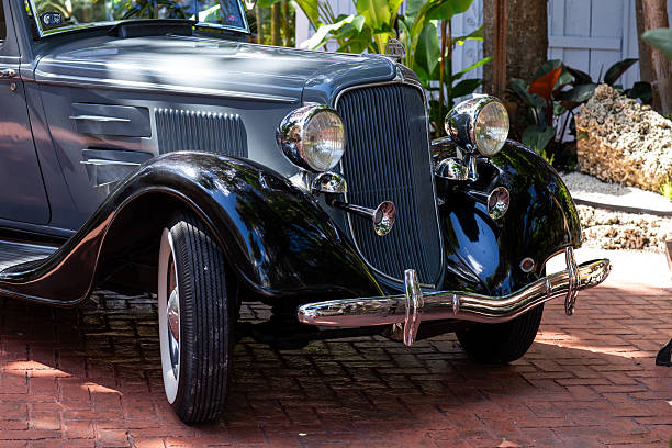 istock Side front view of grey and black classic American car 2248944762