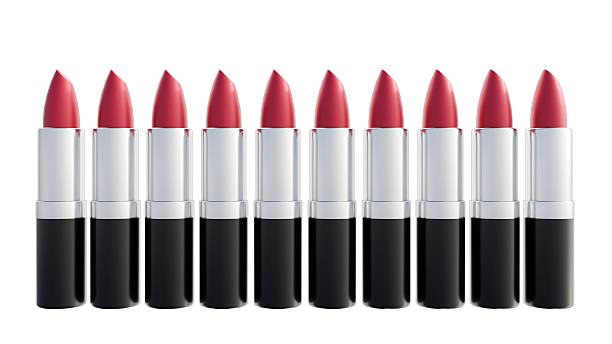 A line of nine identical lipsticks standing upright