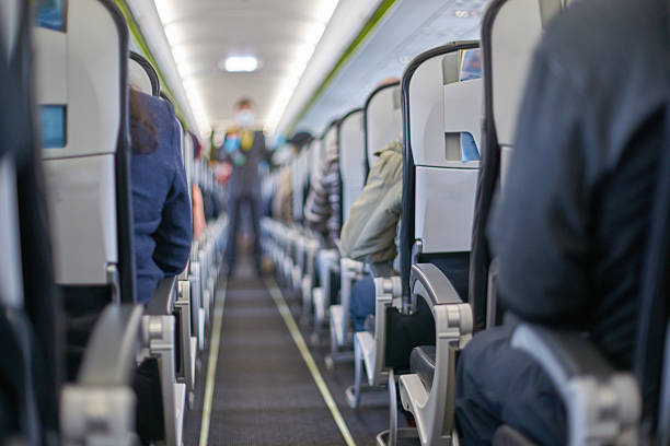 istock Passengers seated inside airplane cabin during flight journey with focus 2248948332