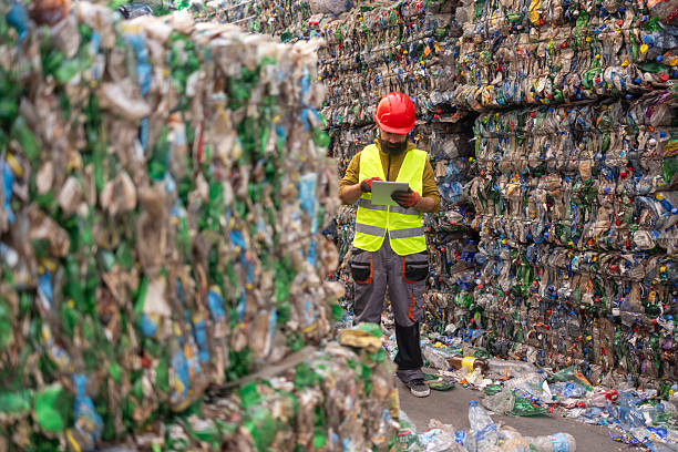 istock Waste Management Engineer with Digital Tablet at Recycling Site 2248948813