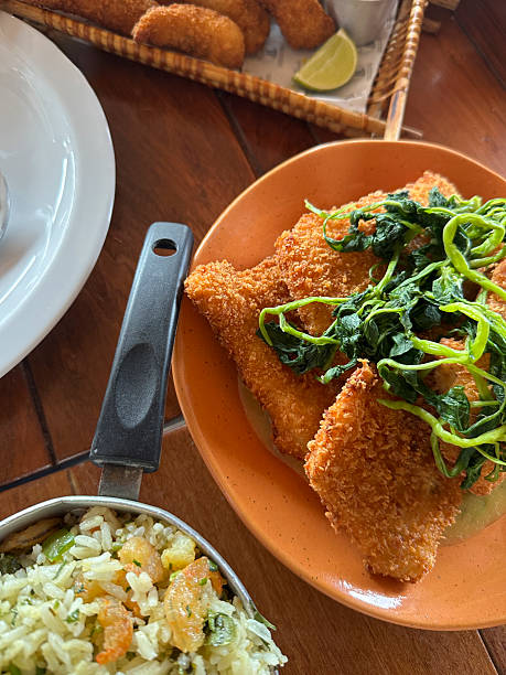 istock Breaded fried fish fillet with rice and fried dumplings 2248949134