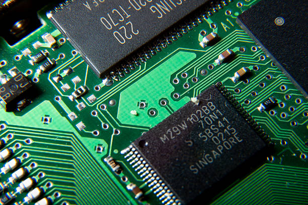 A close-up of an electronic circuit board with a microcircuit and SMD components