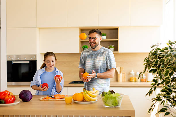 istock Family bonding in a bright kitchen with fun food activities 2248952829