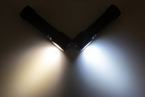 close up of triple strip of LED bulbs on a loft light isolated on a black background