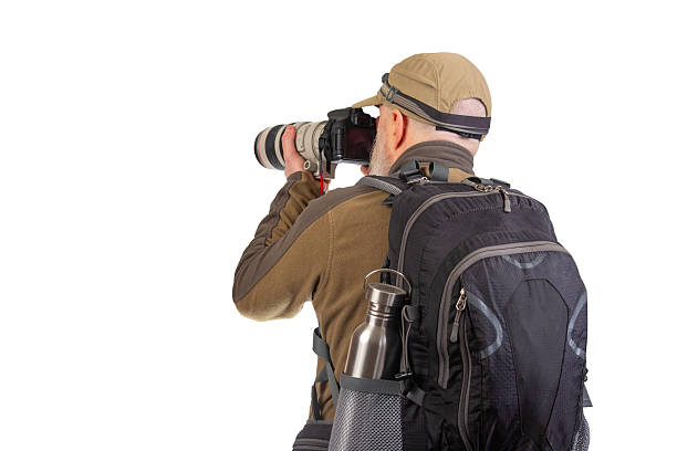 istock Photographer capturing stunning images with a camera in outdoor setting 2248955662