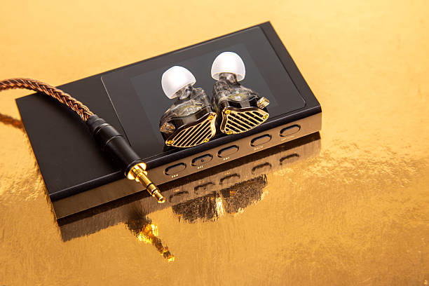 istock High-quality audio equipment showcased on a reflective golden surface during a product display 2248955737