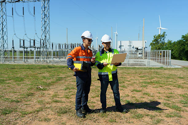 istock Engineers are checking the operation of a large wind turbine that is working to generate electricity in a wind farm. 2248959794
