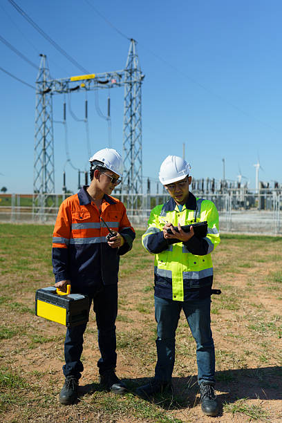 istock Engineers are checking the operation of a large wind turbine that is working to generate electricity in a wind farm. 2248959830