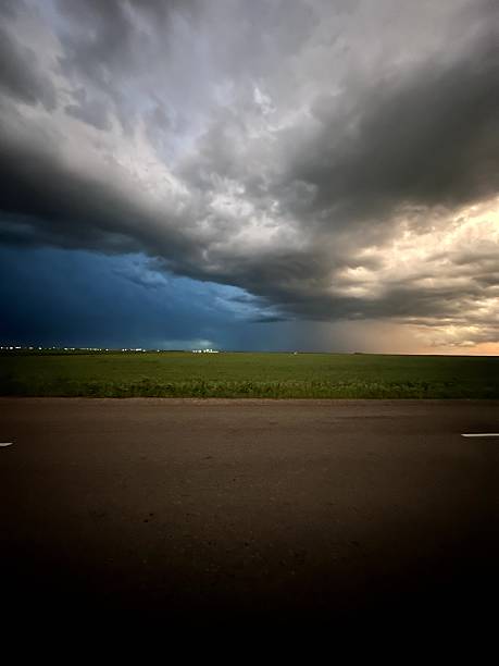 istock Storm clouds looming, Gray storm clouds hover above countryside 2248962368