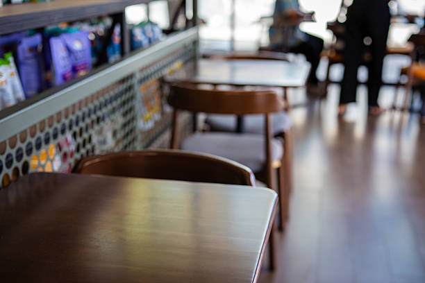 Empty wooden chair in modern coffee shop food and drink interior