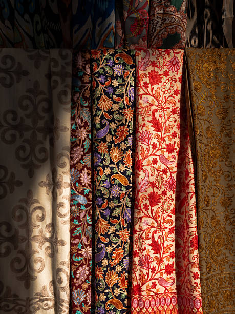 istock Uzbek Silk Shawls Hanging in Colorful Textile Market Display 2248963954