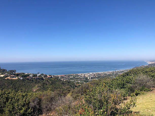 istock Scenic Coastal View From a Hillside Overlooking the Ocean and the Distant Shoreline With Clear Blue Skies 2248970227