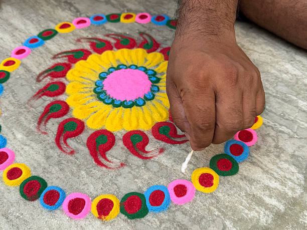A chalk drawn Rangoli with fresh flowers