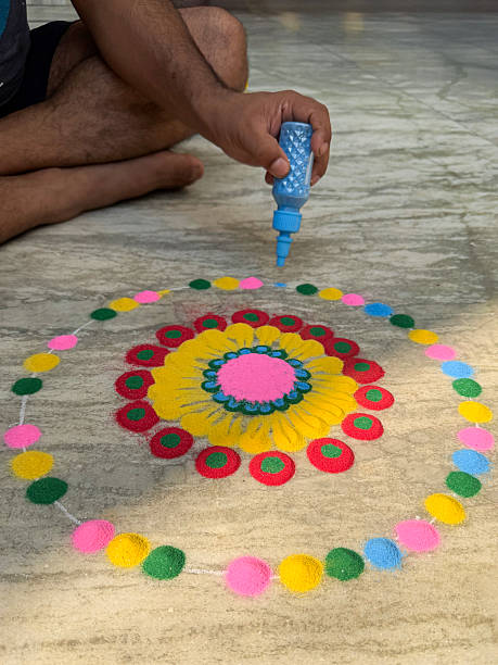 istock Image of colorful Indian rangoli pattern made with paint powder and gulal, adorned with flowers, celebrating diwali festival 2248970844
