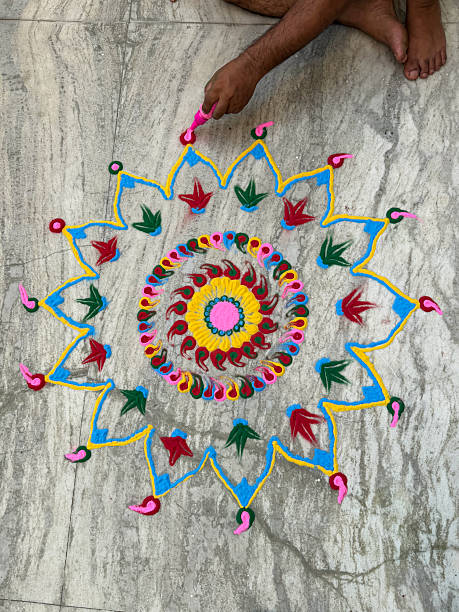 istock Image of diwali celebration featuring colorful Indian rangoli pattern made with paint powder and gulal, decorated with flowers 2248970889