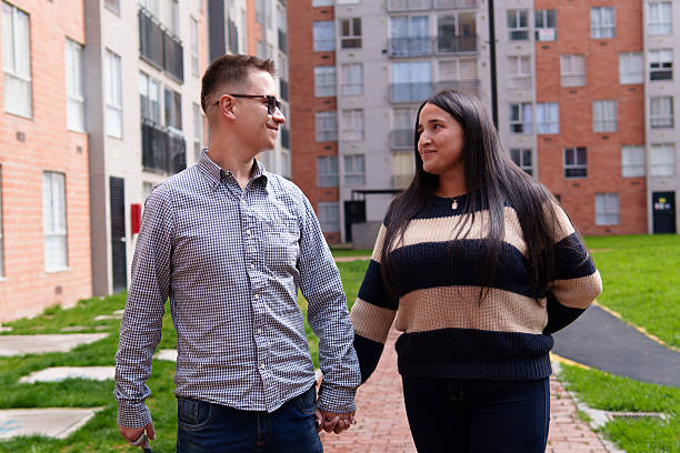 istock Young couple walking together holding hands 2248973013