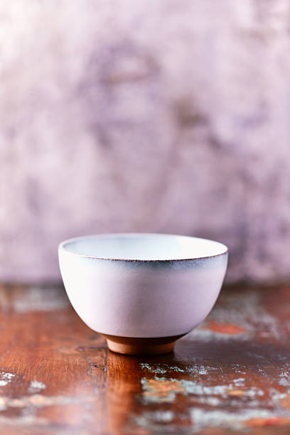 Traditional, handcrafted ceramic on wooden background. Soft focus. Close up.