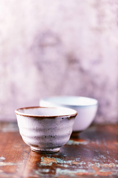 Traditional, handcrafted ceramic on wooden background. Soft focus. Close up.