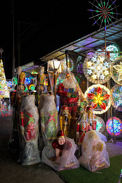 istock Christmas Statues Wrapped in Plastic at Lantern Market at Night 2248976930