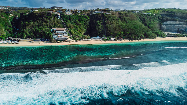 istock Scenic tropical coastline with cliffs and blue ocean with waves in Bali. Aerial view 2248977779