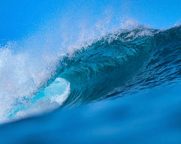 istock Majestic ocean swell with shimmering sunlight and foamy crest 2248979600