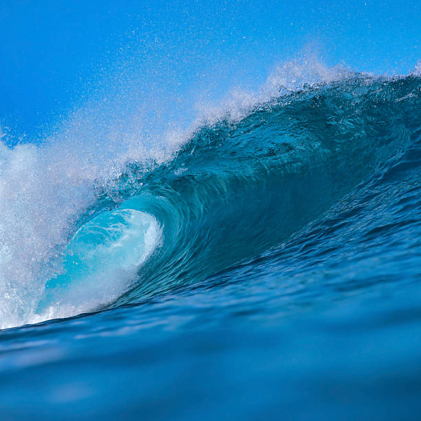 istock Majestic ocean swell with shimmering sunlight and foamy crest 2248979738