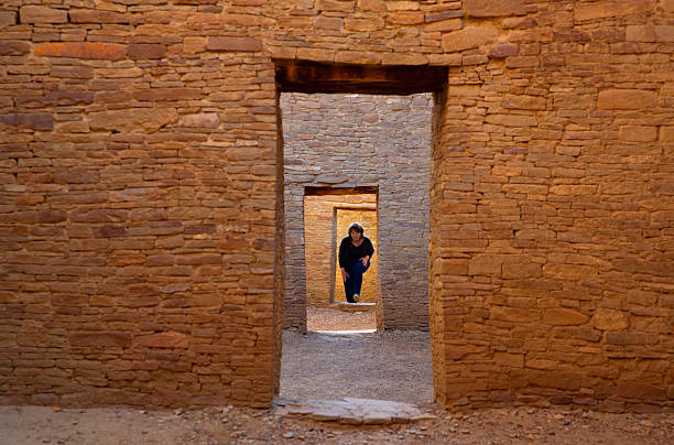 USA New Mexico, Chaco canyon  ancient ruins, female tourist exploring