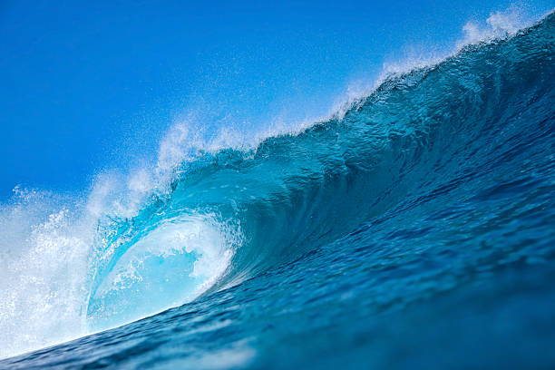 istock Majestic ocean swell with shimmering sunlight and foamy crest 2248980220