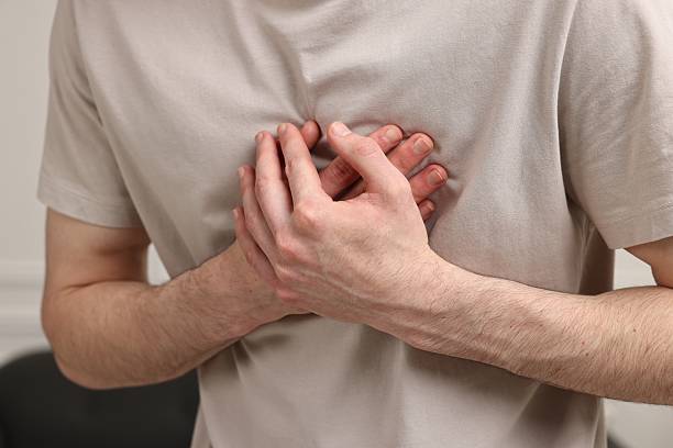 istock Man suffering from heart hurt at home, closeup 2248980551