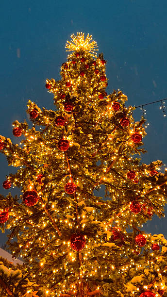 istock A large Christmas tree decorated with bubbles and warm lights outdoors. 2248984742